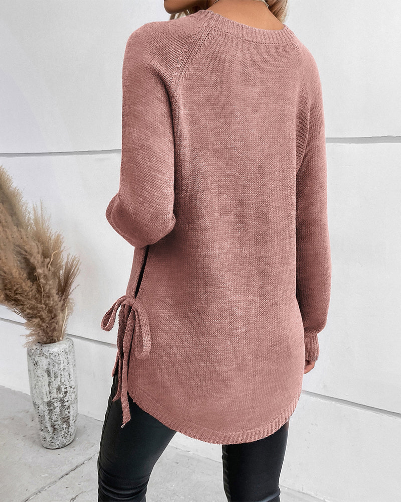 Elegante effen trui met vetersluiting